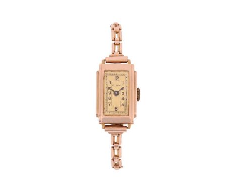 CYMA A ‘9ct’ Dress Watch Bezel: Smooth, SteppedCase Material: Marked ‘9ct’Case Diameter: Approximately 15mm x 21mmDial: Gold-