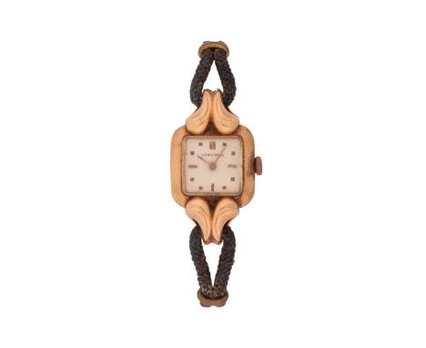 Longines An ‘18K’ Wrist Watch Reference: 148.5744Serial: 7489050 (to movement)Year: circa 1940Bezel: Smooth, Stylised Scrolle