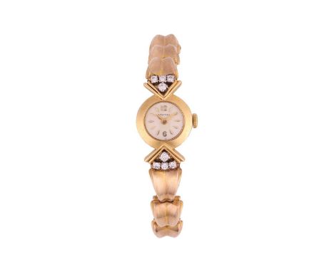 Longines A Gold and Diamond-set Cocktail WatchReference: 28Serial: 9712515 (to movement)Year: circa 1960sBezel: SmoothCase Ma