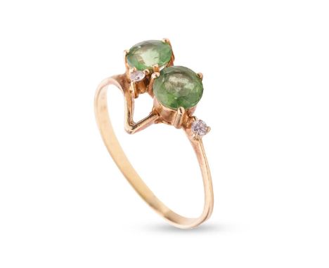 A tourmaline and diamond dress ring by H.Stern, comprising two circular-cut yellowish-green tourmalines and two diamond accen