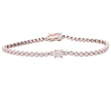 A diamond-set tennis bracelet; featuring a central larger oval-cut diamond, measuring approximately 6mm x 4.1mm, to a row of 