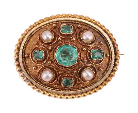 An emerald and split pearl oval panel brooch; comprising a central oval-cut emerald of vivid green colour in a scalloped beze