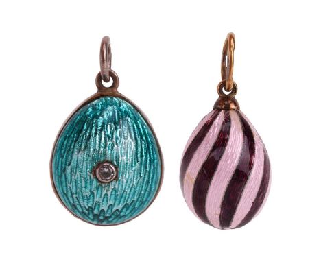 Two Russian guilloche enamel egg charms; the first with swirl pattern of pink and purple colour, yellow metal struck with Rus