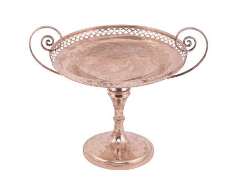 An Edwardian silver fruit stand; circular with scrolling side handles and lattice-pierced border; on knopped trumpet-form bas