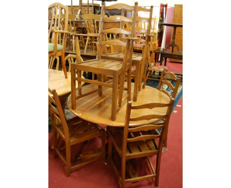 A contemporary Ercol mid elm dining suite comprising; D-end extending dining table with pull-out action and single fold-out l
