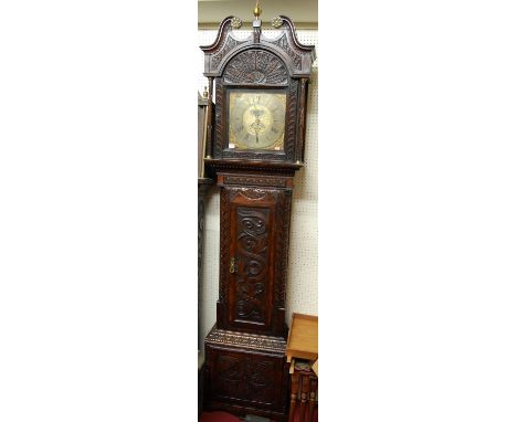 Thomas Lister - an antique oak longcase clock, having 12" square brass dial, with rolling date dial and moon dial, thirty hou