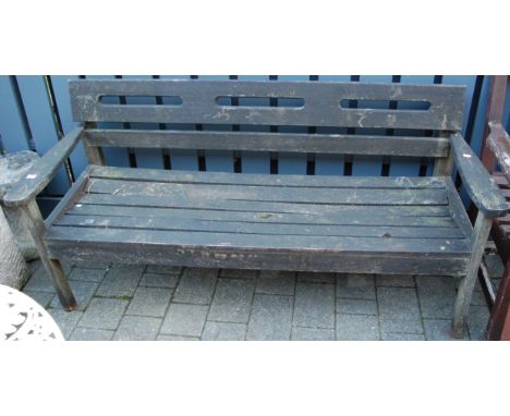A contemporary slatted teak three-seater garden bench, w.156.5cm