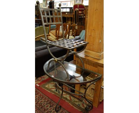 A contemporary steel demi-lune glass top console table, together with a matching side chair (2)