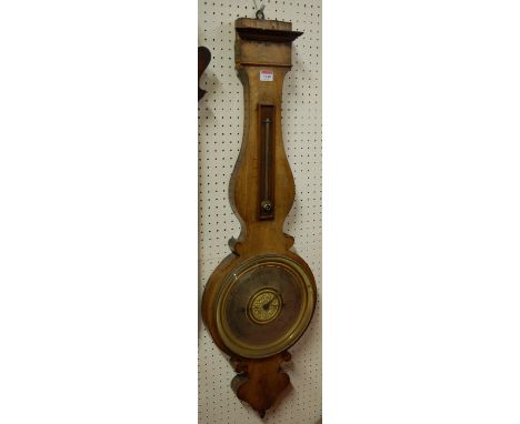 An early 19th century French mahogany cased wheel barometer having a silvered dial with embossed brass centre signed indistin