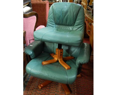 A Danish Unico formed laminate framed and leather upholstered swivel reclining armchair, with matching footstool (2). Some li