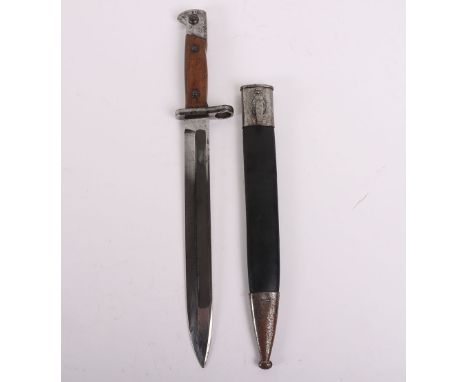 Imperial German M1871/84 Bayonet, with two piece wooden grips, steel pommel and short cross guard with muzzle ring. The cross