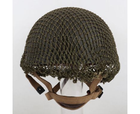 WW2 British 1944 Dated Paratroopers Steel Combat Helmet, with its original green paint finish to the shell which has original