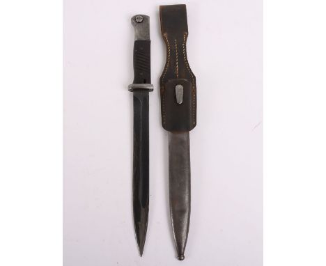 1941 Dated Matching Numbers German K98 Combat Bayonet, with two piece grips, steel pommel and housed in steel scabbard. The s