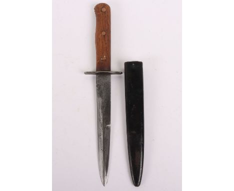 WW2 German Combat Boot Knife, with two piece wooden grips having copper fixing studs. Steel cross guard and housed in blacken