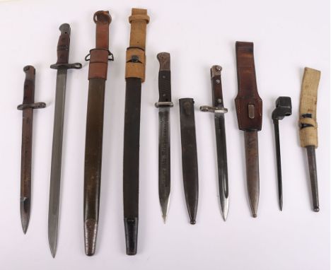 Scarce P-1917 Bayonet by Winchester, fine example with wooden grips, steel pommel with oil hole. Housed in original scabbard 