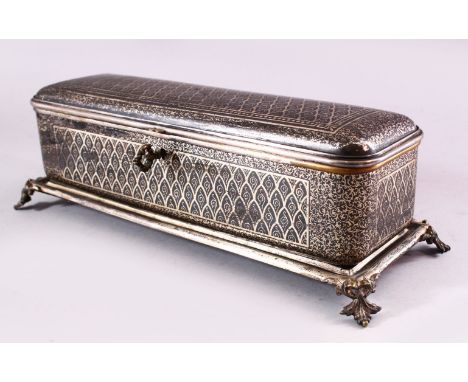 A BIDRI SILVER INLAID RECTANGULAR HINGED CASKET for the European market, with panels of scrolling inlaid decoration, the inte