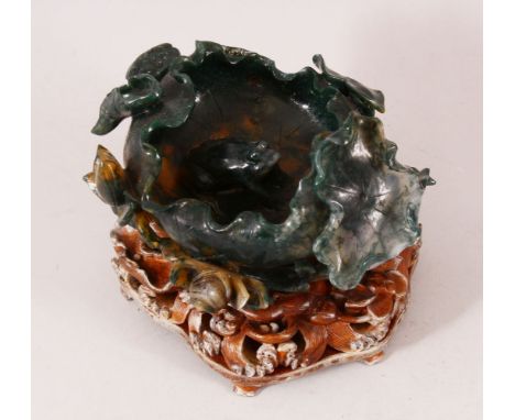A GOOD CHINESE DARK GREEN JADE LOTUS BRUSH WASHER, together with a good quality wire inlaid carved and fitted hardwood stand,