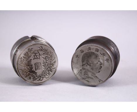 TWO GOOD CHINESE COIN / CURRENCY MOULDS OR PRESS, one with a figure and calligraphy, the other with flora and calligraphy, 4.