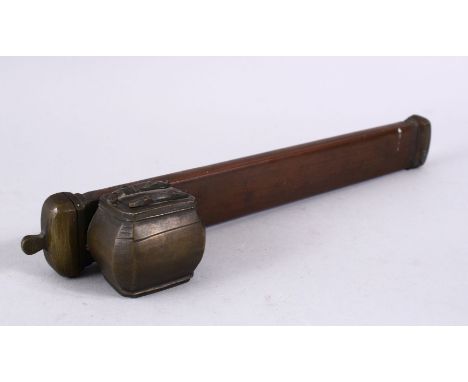 A GOOD ISLAMIC BRASS SIGNED INKWELL AND PEN HOLDER, 25CM X 5CM.