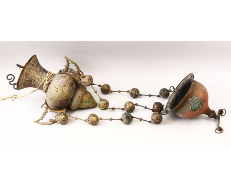 A 19TH CENTURY ISLAMIC BRASS / STEEL OPENWORK CALLIGRAPHIC HANGING LAMP.
