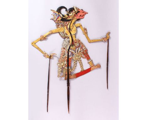 A LARGE 19TH CENTURY INDONESIAN SHADOW PUPPET WITH RHINO HORN STICKS, 73cm.