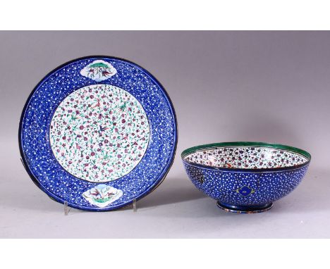 A 19TH CENTURY PERISAN ENAMEL BOWL AND DISH, the bowl with a white interior with bird and flora decoration, the exterior upon