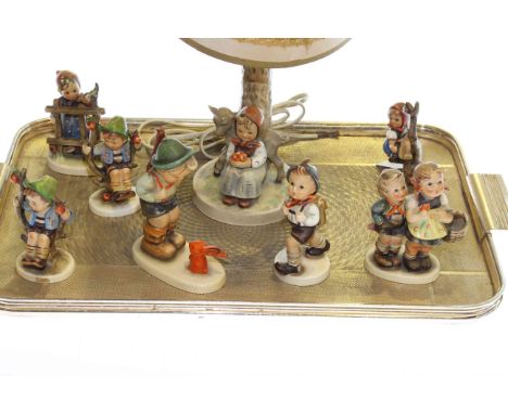 Hummel table lamp and seven Hummel figures