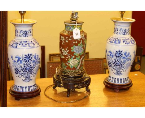 Pair of Oriental pottery table lamps and single lamp with shades