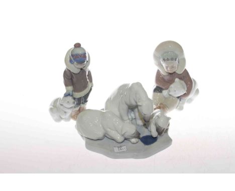 Lladro polar bear group and two Eskimo figures, with boxes