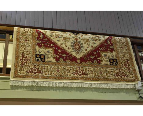 Heriz carpet with a beige ground 2.80 by 2.00