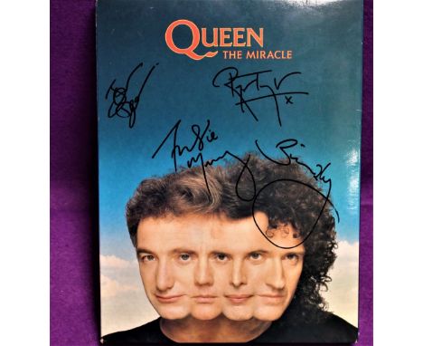 A promo set for Queen's The Miracle - rare with all 4 signatures including Freddie Mercury - was bought at a charity auction 