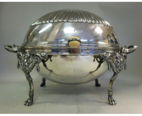 An early 20thC silver plated chafing dish of ovoid form, the rotating demi-reeded cover with an ivory button handle, revealin