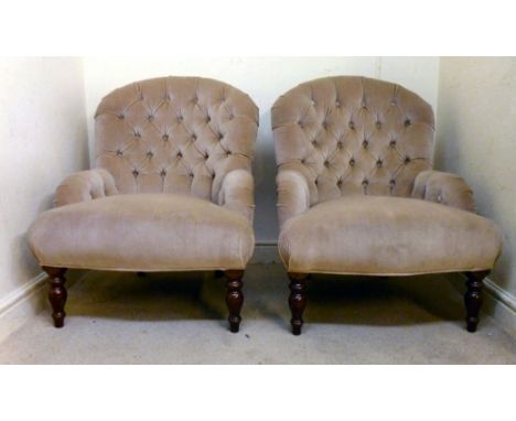 A pair of mid 20thC Victorian style round back boudoir chairs, part button upholstered in mushroom coloured dralon, the serpe