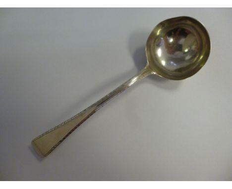 A George III silver sauce ladle, having a circular bowl, on a bright-cut engraved stem  indistinct London marks