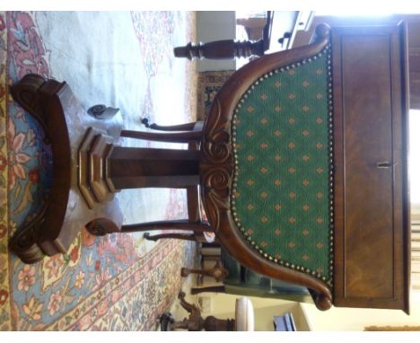 An early 19thC mahogany work table, the drawer enclosing a hinged, sliding green baise scriber, over a curved green fabric co