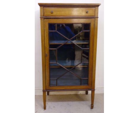 An Edwardian string inlaid and satinwood crossbanded mahogany display cabinet, having a long drawer, over an astragal glazed 