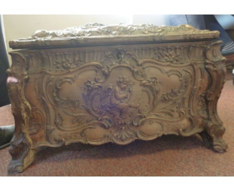 A late 19thC Symphonion, playing 12''dia discs, the table-top case in the style of a casket, richly decorated in simulated ca