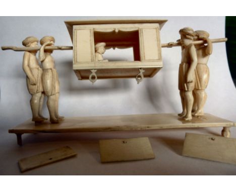 An early 20thC Indian carved ivory model, four figures bearing a woman seated in a palanquin  5.5''w