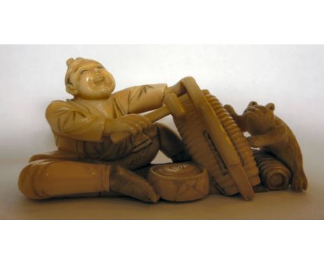 An early 20thC Japanese carved ivory figure, a seated man defending the contents of a basket from a domestic cat  2''h