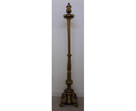A mid 20thC brown painted and carved giltwood standard lamp of square outline with acanthus ornament and a fluted column, on 