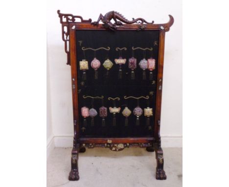 A late 19thC wooden firescreen, attributed to Gabriel Viardot, fashioned in Chinese taste, the crest surmounted by a dragon, 