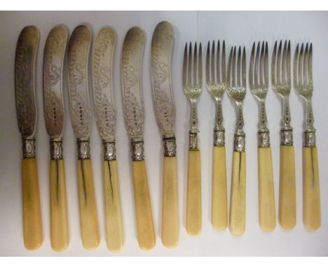 A set of six early Victorian engraved silver fish knives and forks, on ivory handles  John Gilbert & Co  Birmingham 1863