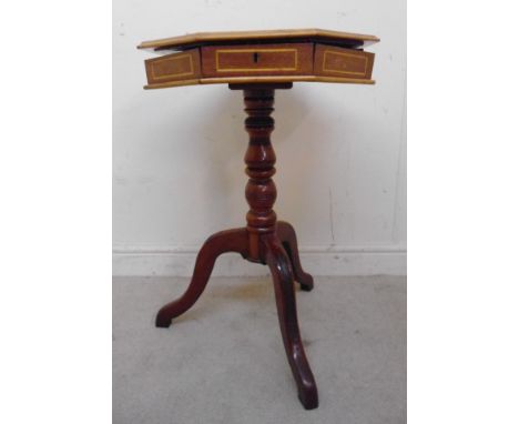 A mid 19thC walnut, satinwood and ebony marquetry pedestal octagonal work table, having a rising top with starburst ornament,