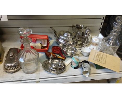 A box of misc items including, decanters, singer sewing machine parts, Viners silver plate and an old boxed pipe.