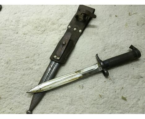 Swedish Mauser 1896 bayonet with scabbard and leather belt frog. This is the conical stud version with single sided blade.