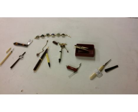 A selection of enamel and bone knives and pencils etc.