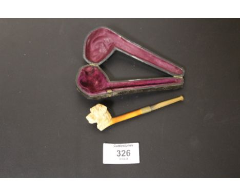 A MEERSCHAUM PIPE  WITH DOGS HEAD CARVING