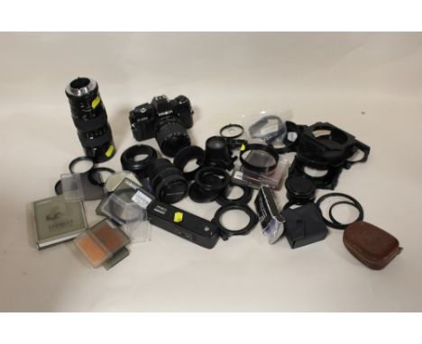 A BAG OF CAMERA ACCESSORIES, LENSES ETC