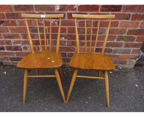 A PAIR OF ERCOL STICK BACK DINING CHAIRS