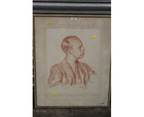 A FRAMED AND GLAZED PENCIL SKETCH PROFILE PORTRAIT SIGNED LOWER RIGHT - OVERALL SIZE 67CM X 54.5CM